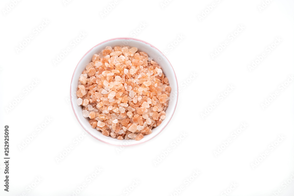 Bowl of pink himalayan salt on white background Bowl of pink himalayan salt on white background