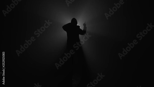 Silhouette of man rapping photo
