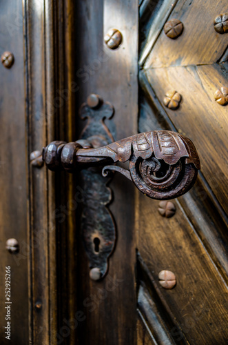 Antique iron forged door handle from the front door.