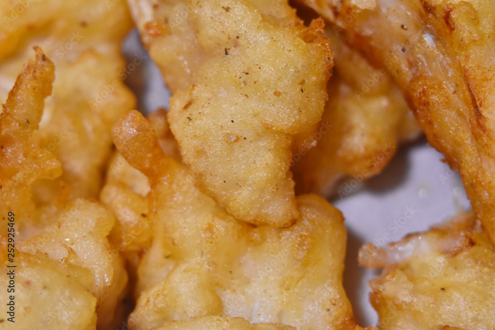 fish pieces fried in batter, fish and chips macro, traditional food, English pub fish pieces fried in batter, fish and chips macro, traditional food, English pub