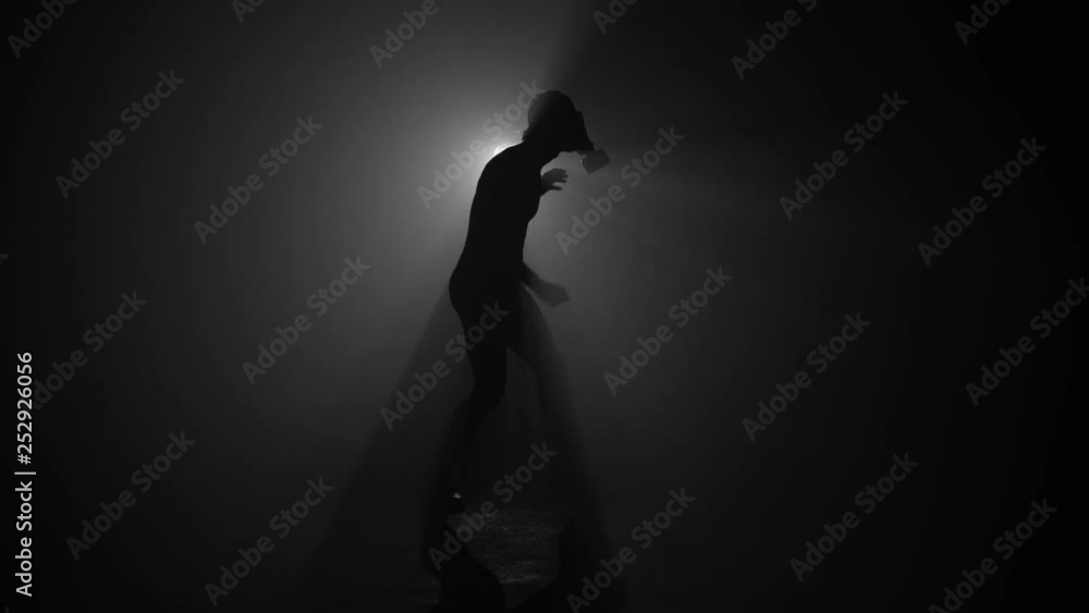 Silhouette of man wearing gas mask in apocalypse Silhouette of man wearing gas mask in apocalypse