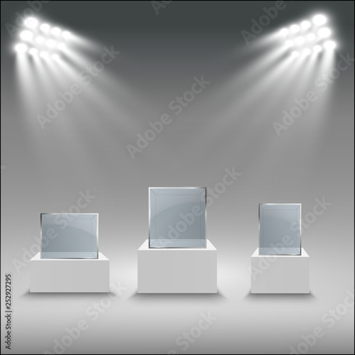 Glass showcase for the exhibition in the form of a cube. Background for sale illuminated by spotlights. Museum glass box isolated advertising or business design boutique. Exhibition hall