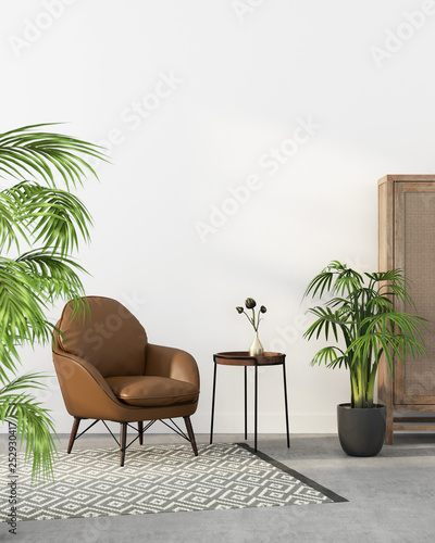 Brown leather armchair and tropical plants