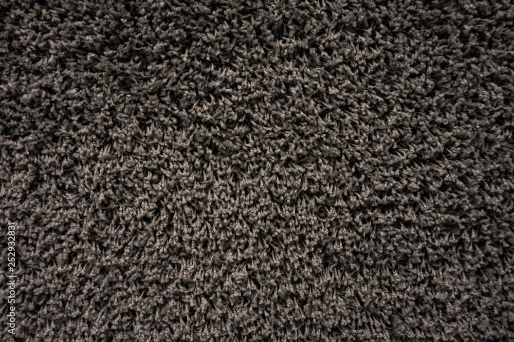 Fototapeta premium Black racpet textile texture close up on the wall