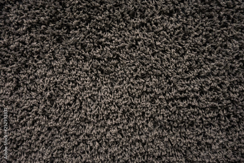 Black racpet textile texture close up on the wall
