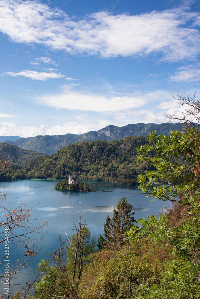 Panoramic view of Bled lake with the church in the island in a sunny day, from the castle