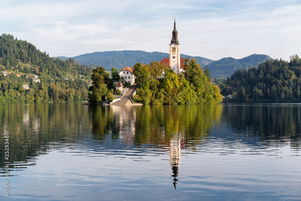 Church of the assumption of Mary in the island of Bled lake, Slovenia, with reflects in the water