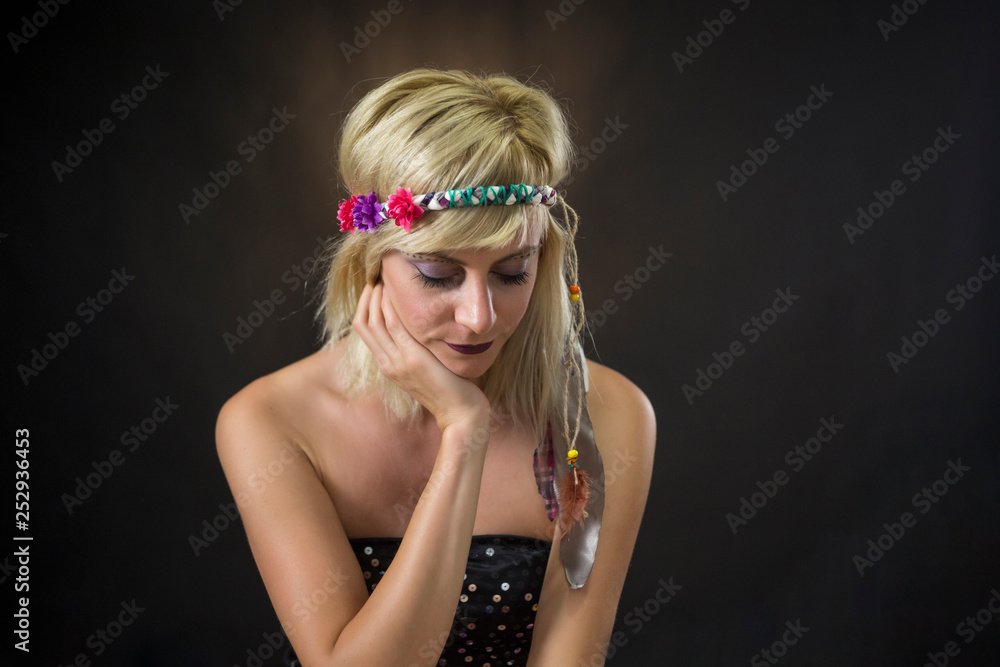 Fototapeta premium portrait of beautiful young woman wearing hippie headband