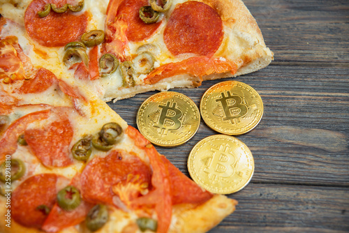 Bitcoin Pizza Day 22 May. Cryptocommunity holiday. concept of buying pizza with bitcoin. photo