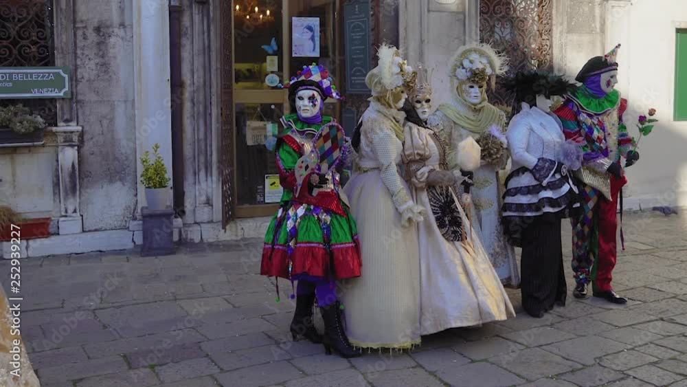 Venice, Italy Carnival mask and costume poses in Campo San Zaccaria. Masked persons in traditional costume pose at a Venetian square during the Venice 2019 Carnival. Venice, Italy Carnival mask and costume poses in Campo San Zaccaria. Masked persons in traditional costume pose at a Venetian square during the Venice 2019 Carnival.