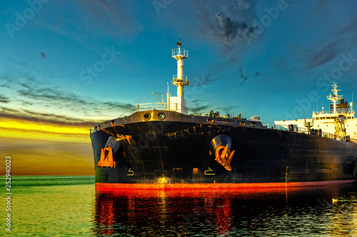 Oil Tanker in the sea at sunrise.