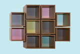 Wooden cube shelves on blue wall