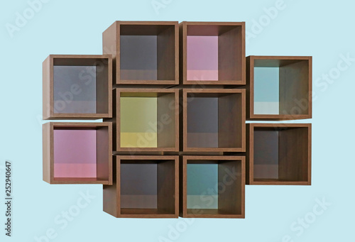 Wooden cube shelves on blue wall