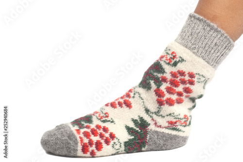 Wool sock on woman's feet isolated on white background