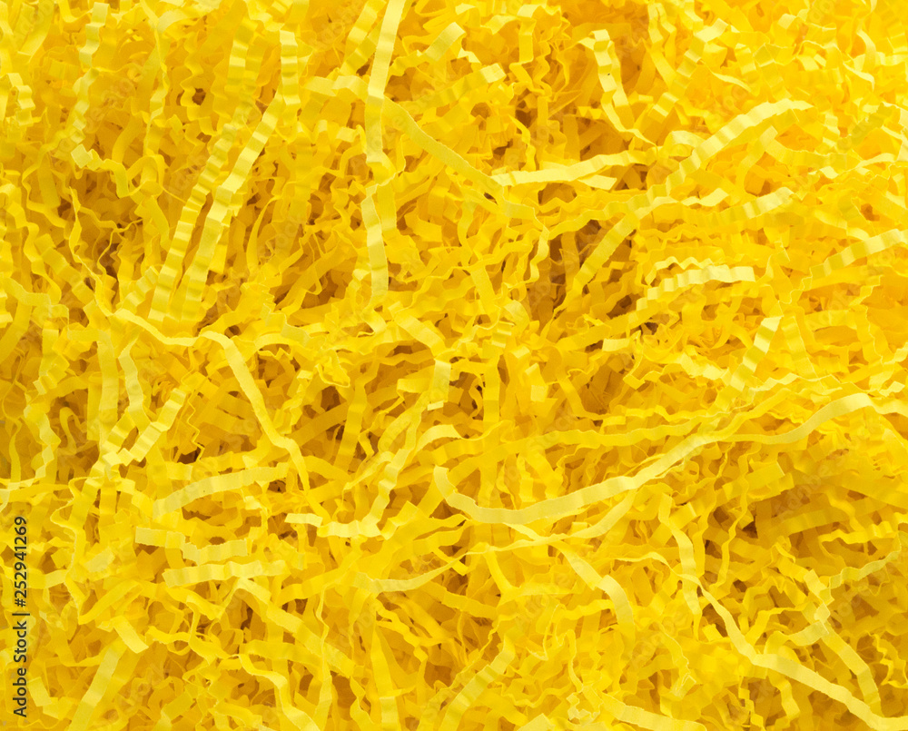 background texture-close up of bright yellow crinkled paper Easter grass background texture-close up of bright yellow crinkled paper Easter grass