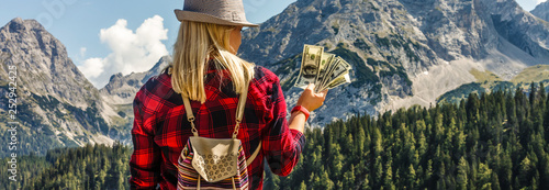 girl with money in the mountains
