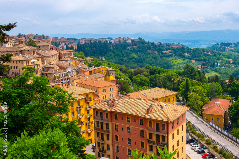 Perugia, Italy - Panoramic view of the Perugia historic quarter with medieval houses and defense walls and surrounding Umbria region valleys