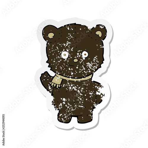 retro distressed sticker of a cute cartoon black bear waving