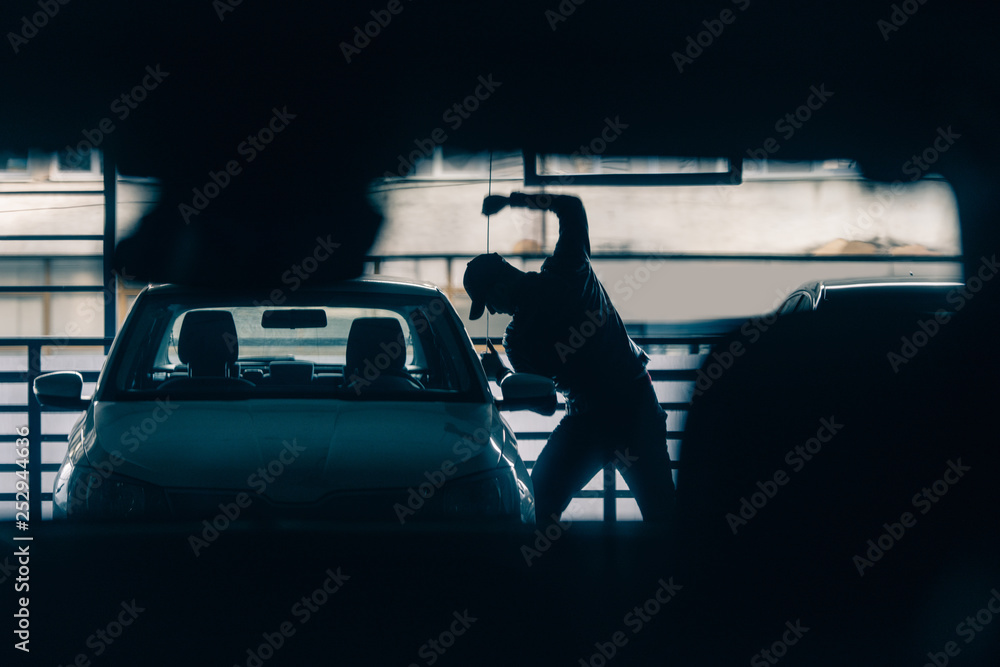 Fototapeta premium Bandit stealing a car