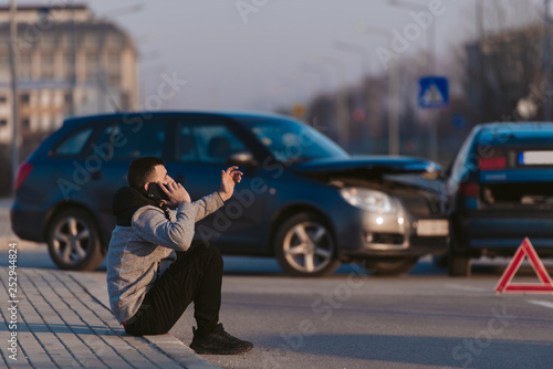 Man making phone call after accident