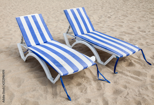 Deck chairs on the sand