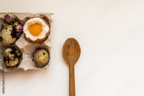 Egg boiled raw chicken egg quail egg tray wooden spoon breakfast white