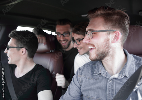Four Friends in a Car Leaving For Vacation © ASDF