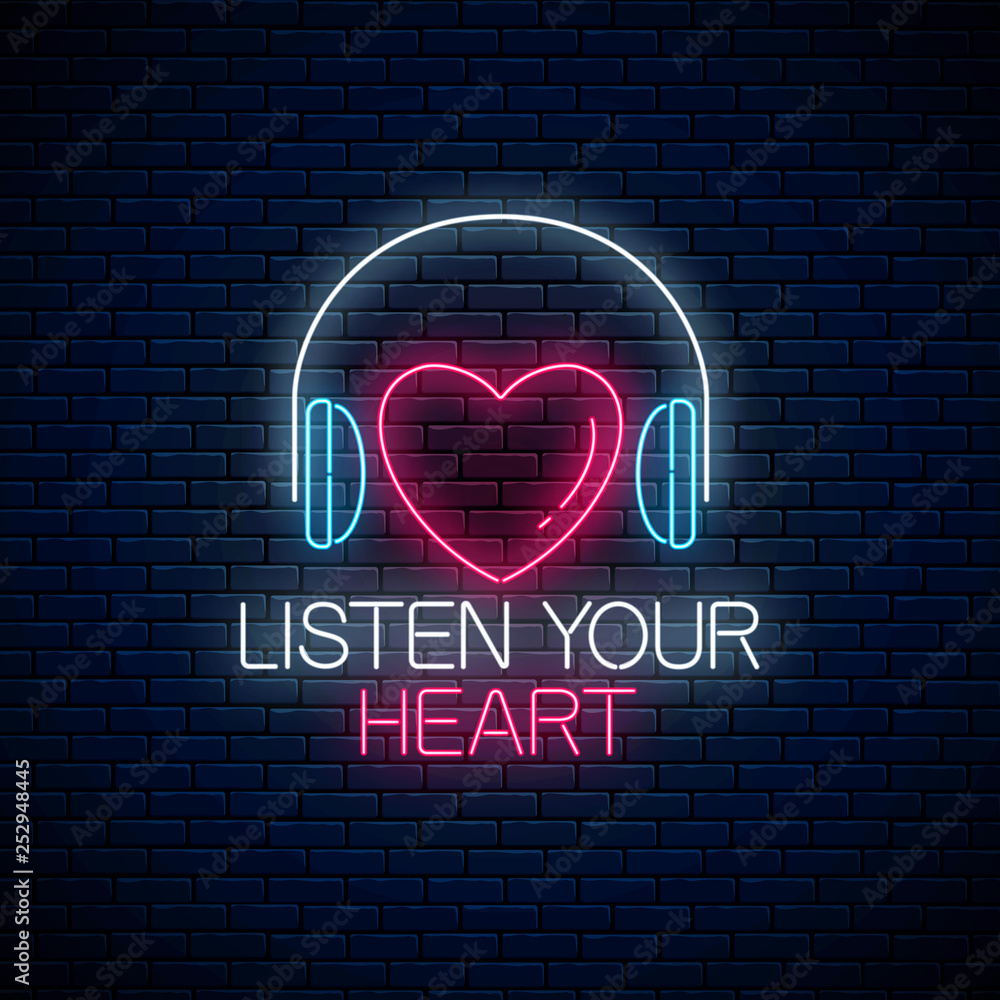 Glowing neon sign with headphones, heart shape and listen your heart slogan. Call to listen symbol with inscription.