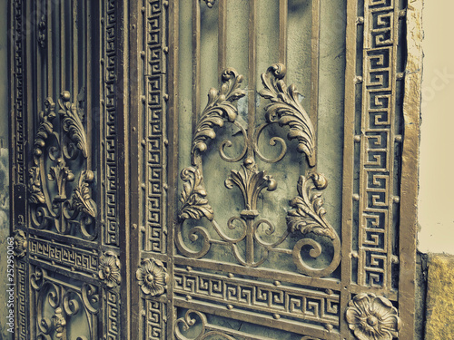 Ornament, detail of an iron gate. Iron-forged gates decor and ornament in the city streets. Old Tbilisi architecture 