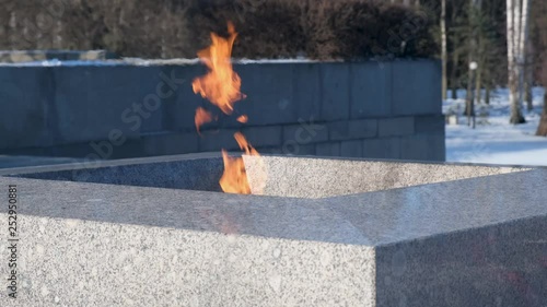 Russia, February 2019: Piskaryovskoye Cemetery in St. Petersburg. Eternal Flame at the Pskaryovsky cemetery Leningrad. photo