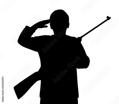 Young man saluting with gun