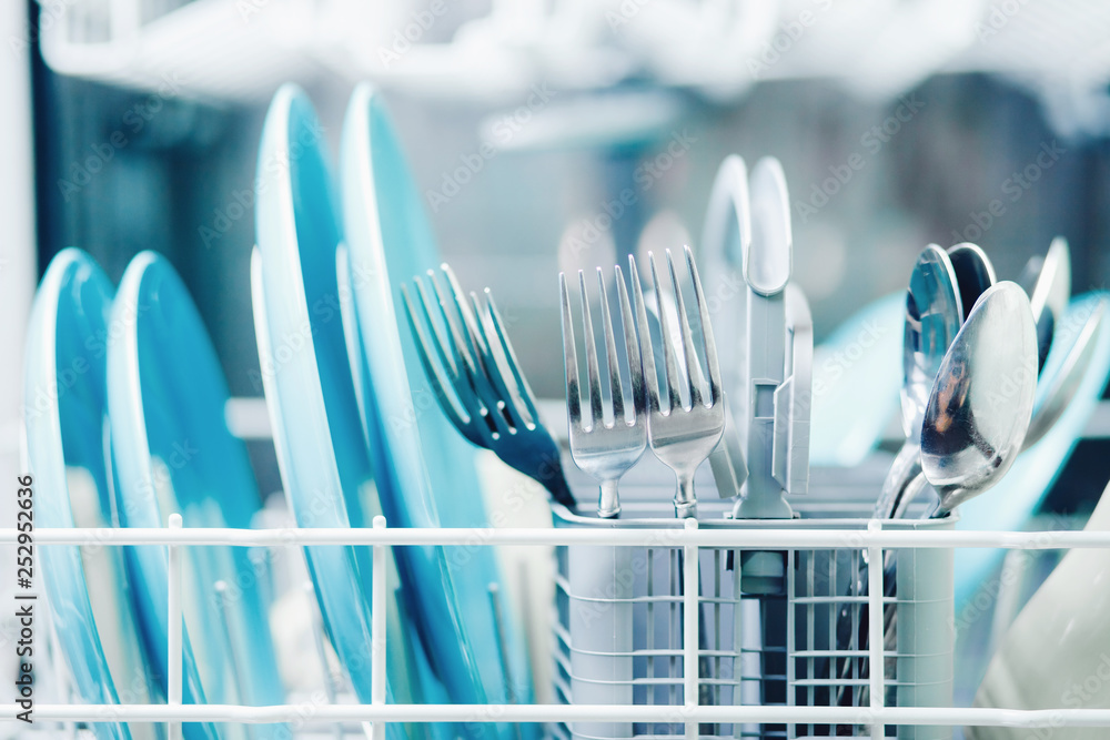 Washing dishes in dishwasher. Concept water saving Stock Photo Adobe
