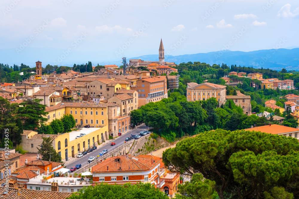 Perugia, Italy - Panoramic view of Perugia and Umbria region mountains and hills with St. Peter Church and Abbey - Cattedrale e Abazia di San Pietro