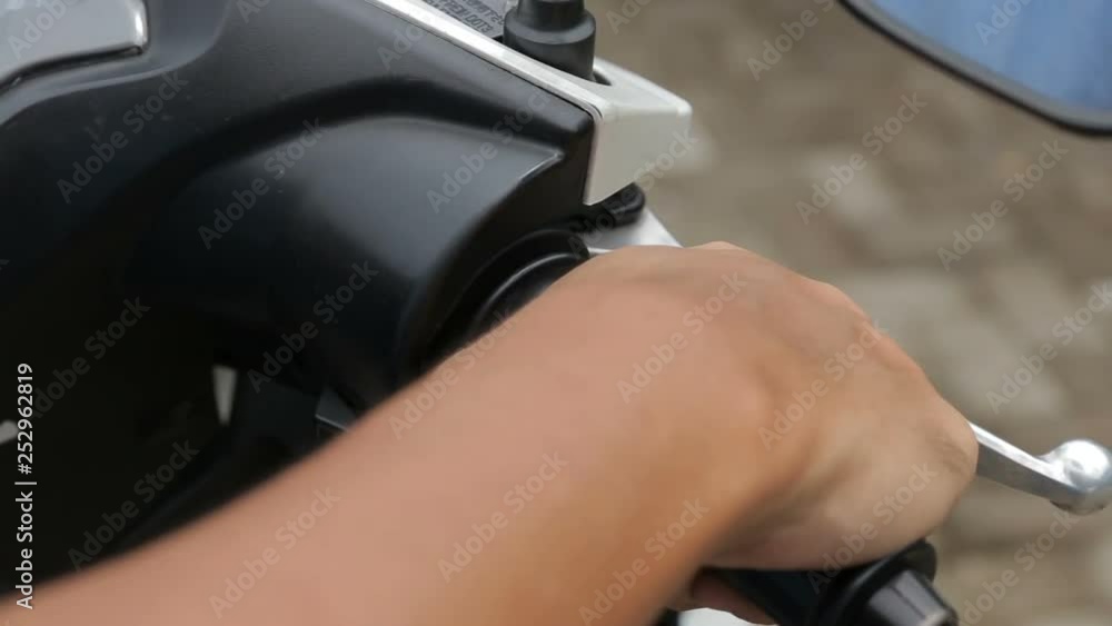 The user inserting the key and starting the engine The user inserting the key and starting the engine