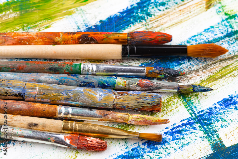 Fototapeta premium Paint brushes and paints for drawing.