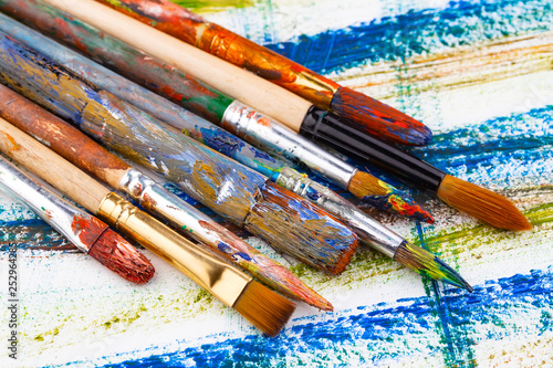 Paint brushes and paints for drawing.