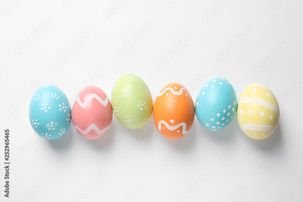 Beautiful painted Easter eggs on white background, top view Beautiful painted Easter eggs on white background, top view