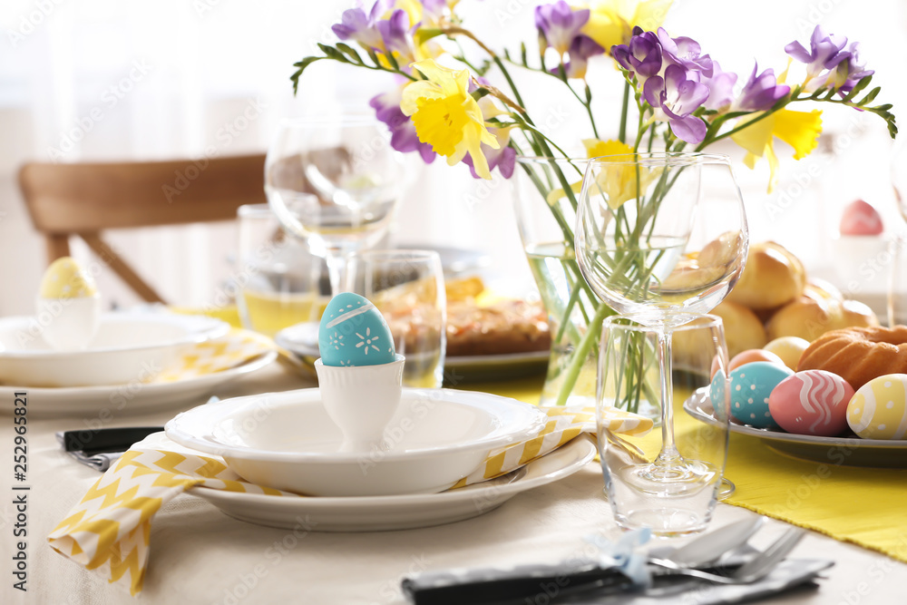 Festive Easter table setting with traditional meal at home Festive Easter table setting with traditional meal at home