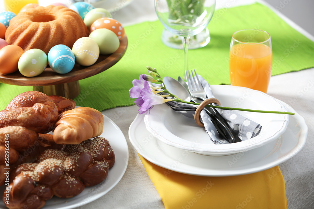 Festive Easter table setting with traditional meal Festive Easter table setting with traditional meal