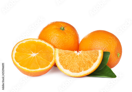 Fresh ripe oranges with leaves isolated on white