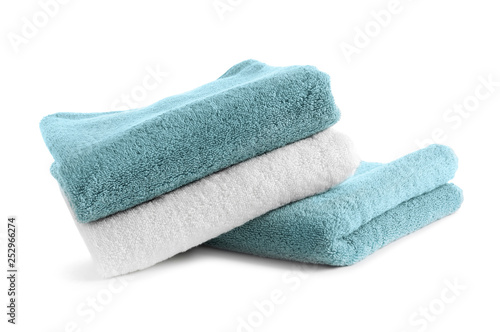Stack of clean soft towels on white background