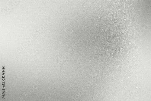 Shiny rough silver metal wall, abstract texture background