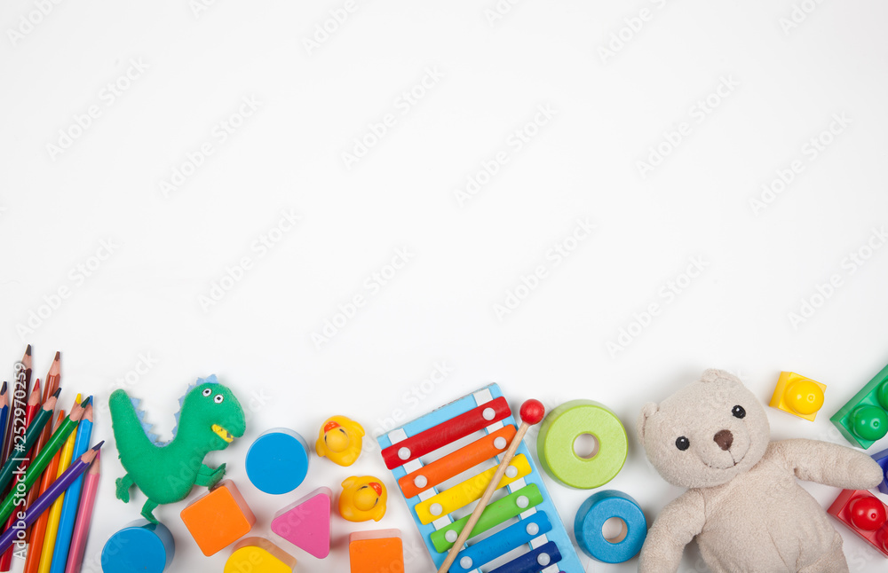 Baby kids toys on white background with copy space for text - obrazy, fototapety, plakaty 