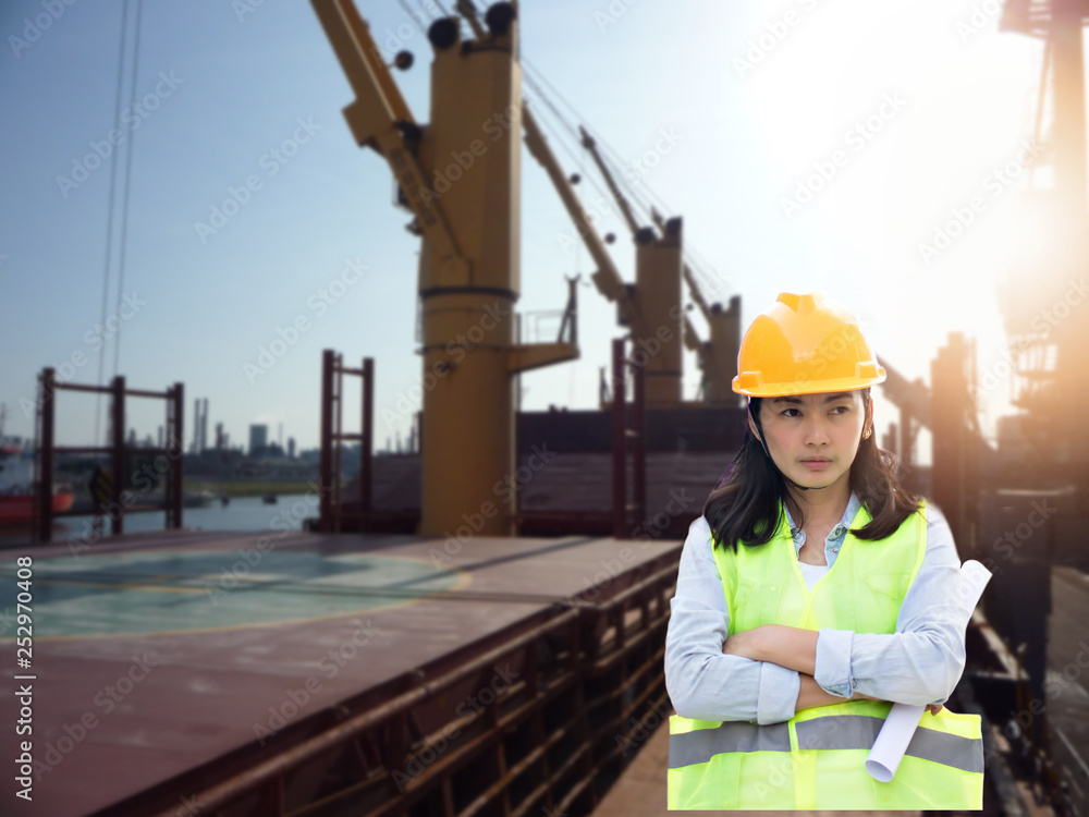 Women Engineering wearing hard hat and working at construction site Women Engineering wearing hard hat and working at construction site