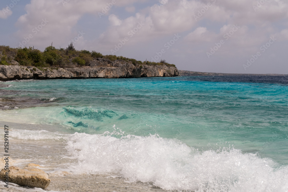 beach of broken corals on the west coast of the tropical island Bonaire in the Caribbean