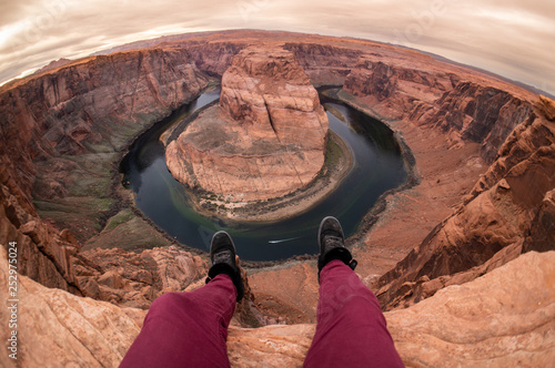 Hanging Legs, Shoes and Feet Over the Ledge at Horseshoe Bend