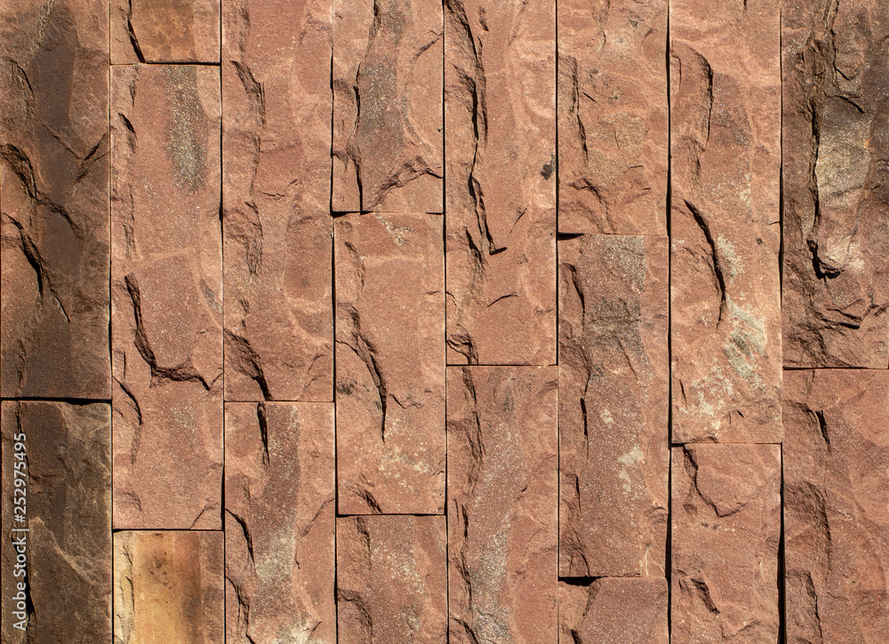Fototapeta premium Orange facing stone, slate, sandstone and travertine marble texture