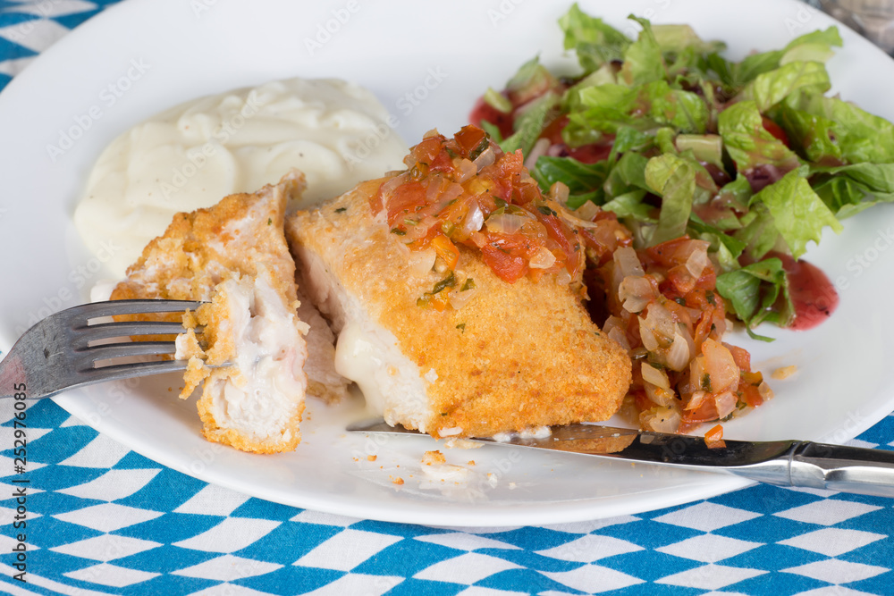 Chicken Cordon Bleu with Salad and Potatoes on Bavarian Colors Chicken Cordon Bleu with Salad and Potatoes on Bavarian Colors