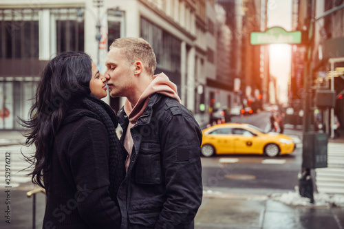 Happy tourist couple in love is kissing and travelling in New York City