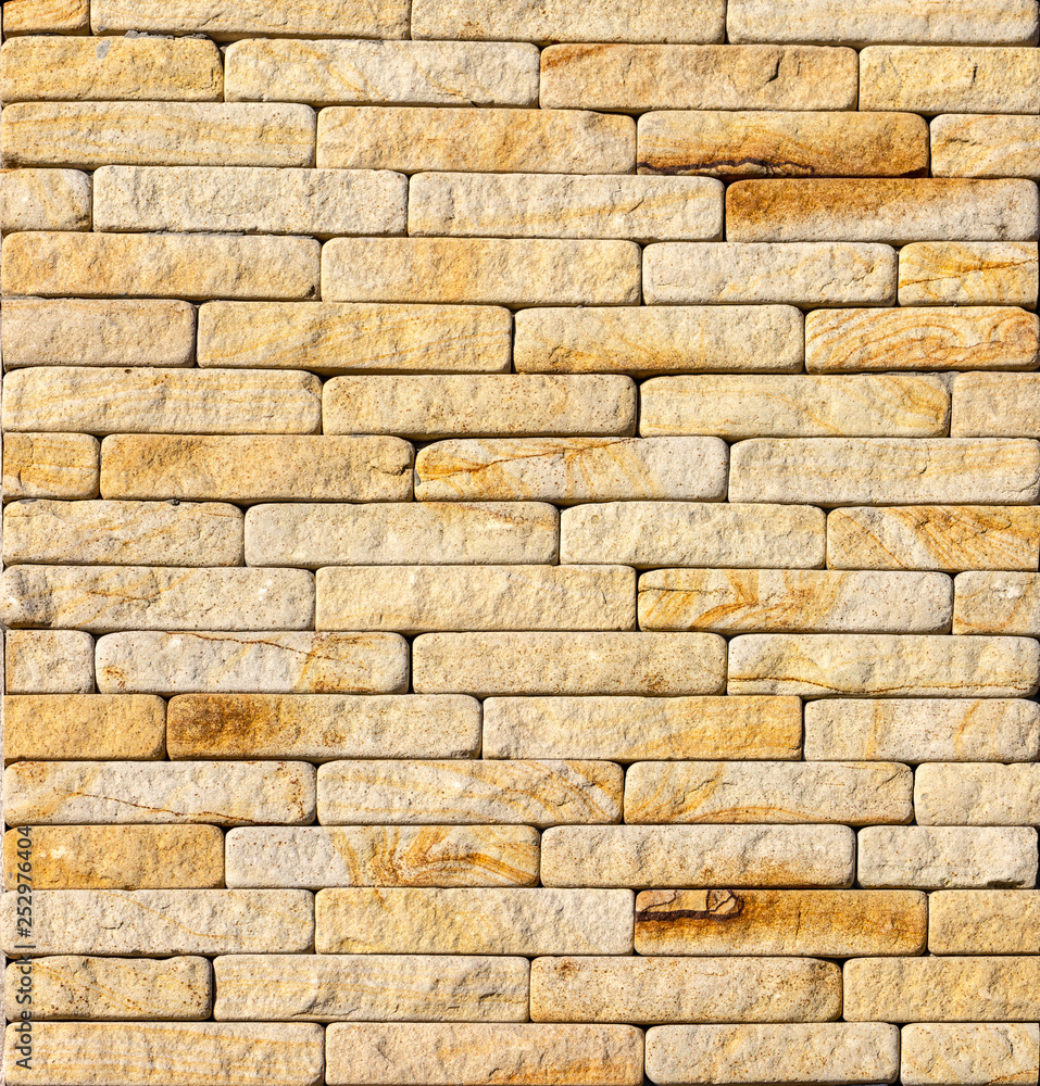 Fototapeta premium Orange facing stone, slate, sandstone and travertine marble texture